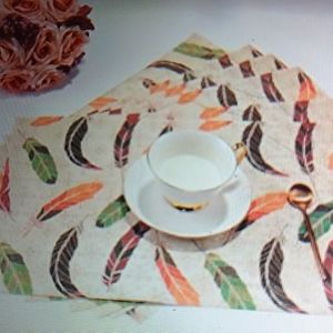 Beautiful 6 pc set of Feather print placemats. NWT"